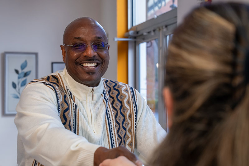 patient being greeted at the front desk of the dental center