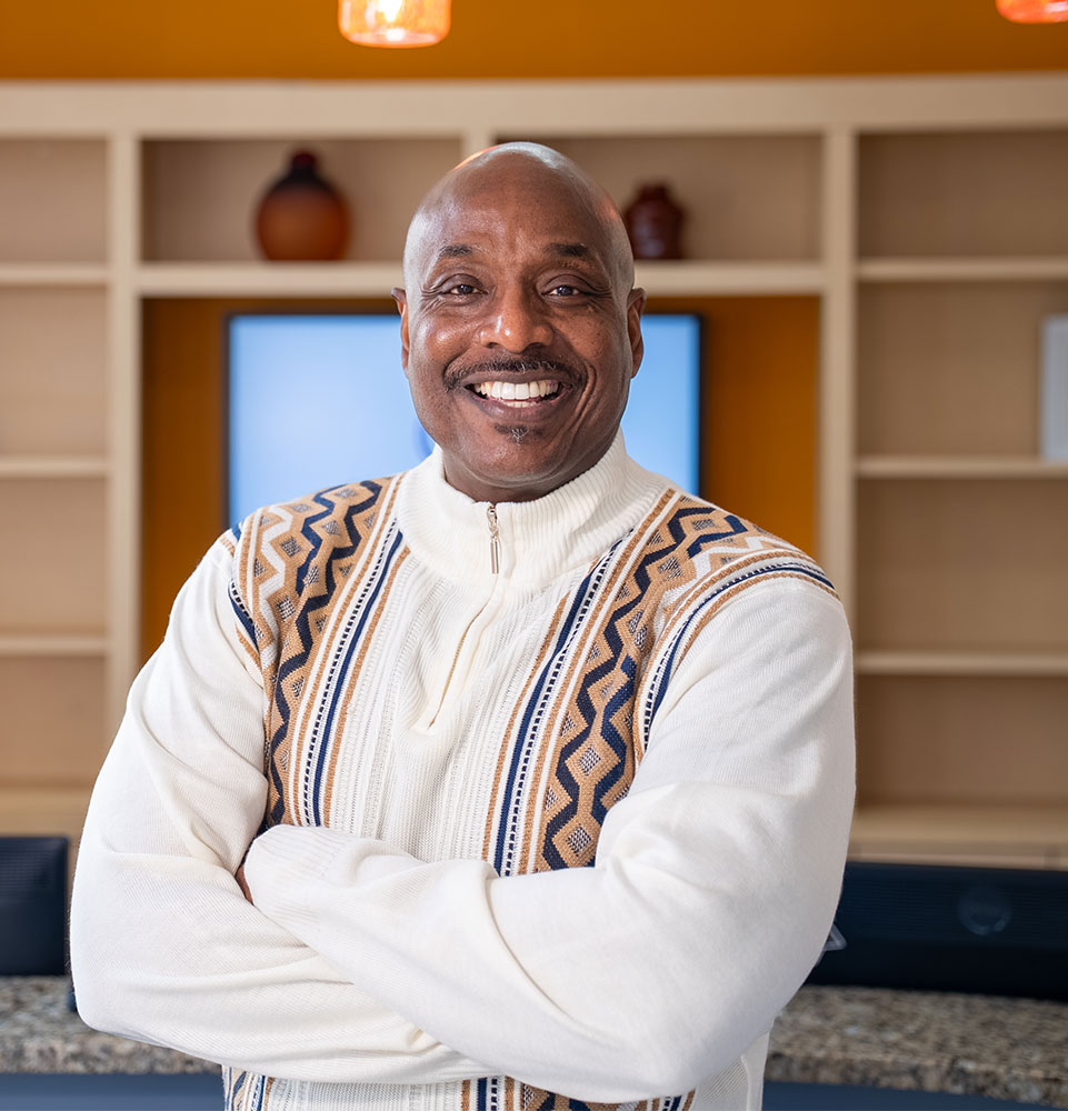 headshot of patient smiling brightly after their dental procedure