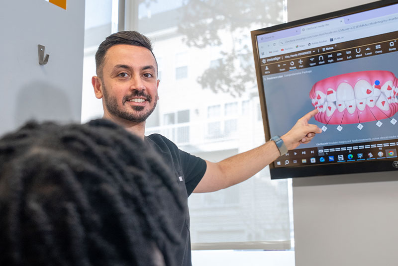 doctor going over dental details with dental patient