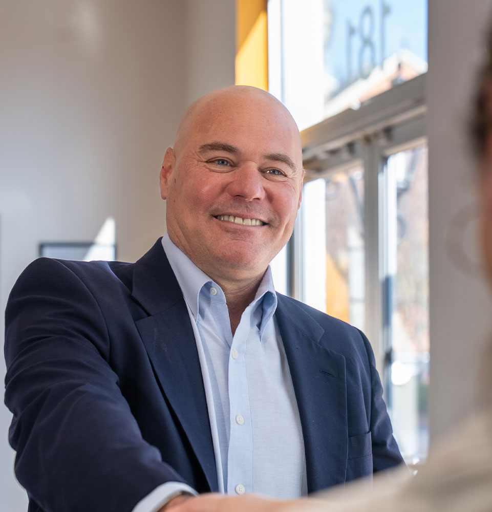 patient smiling and being helped at the front desk of the dental center