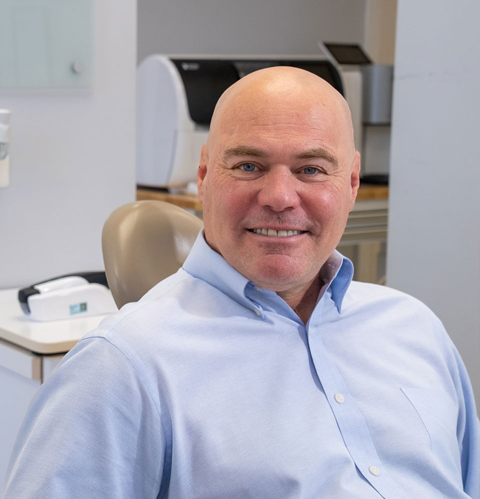 patient smiling and prep for dental treatment