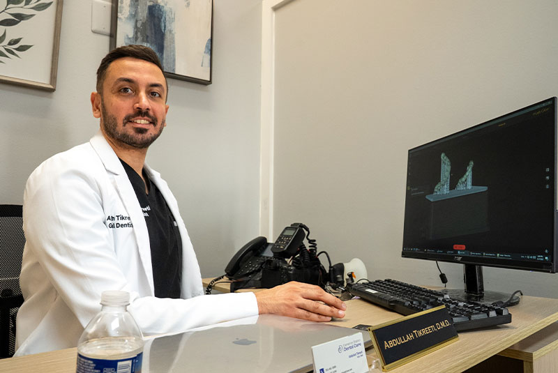 doctor going over dental model within the dental center