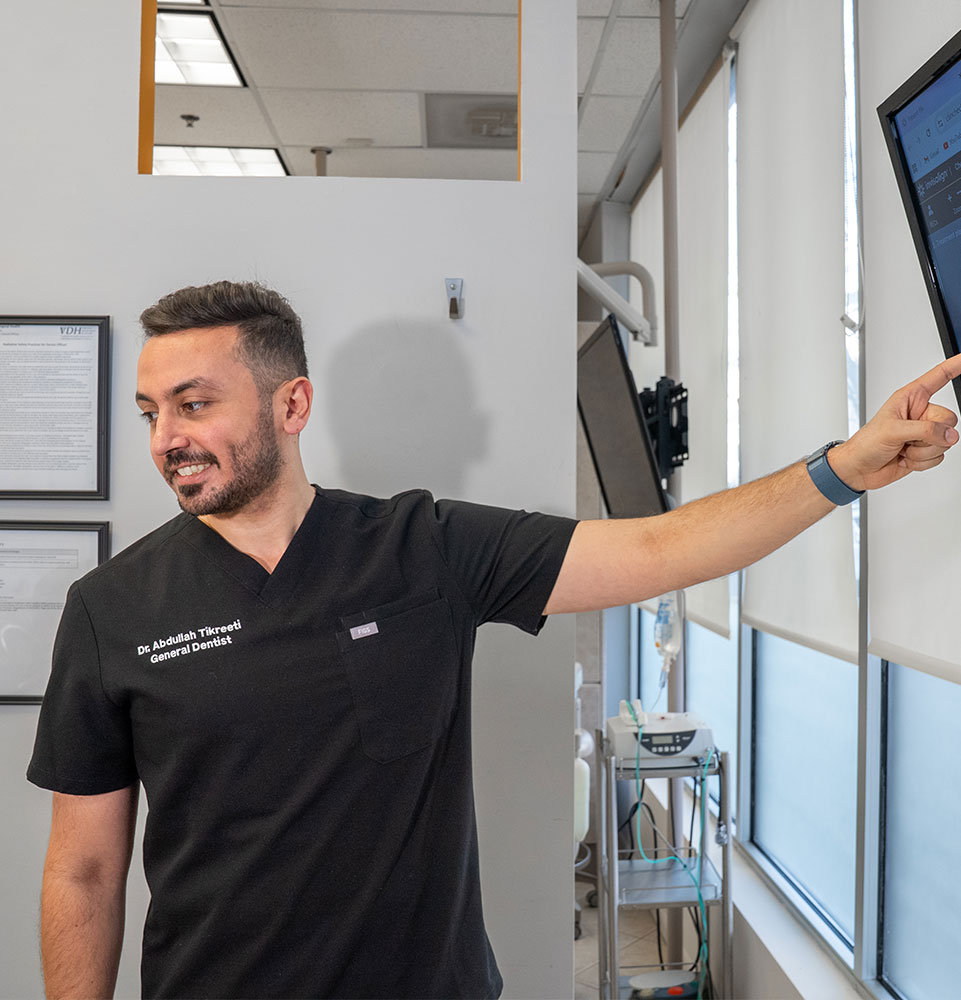 doctor going over dental procedure information with patient