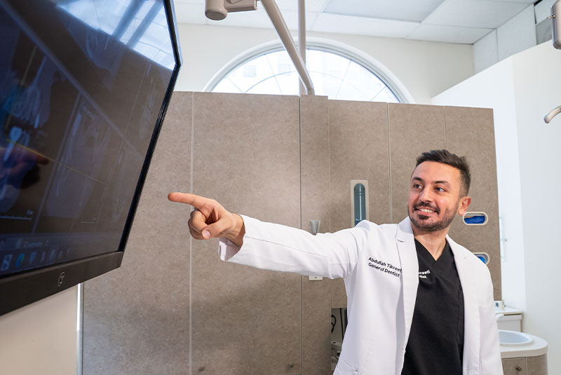 doctor going over dental procedure information with patient