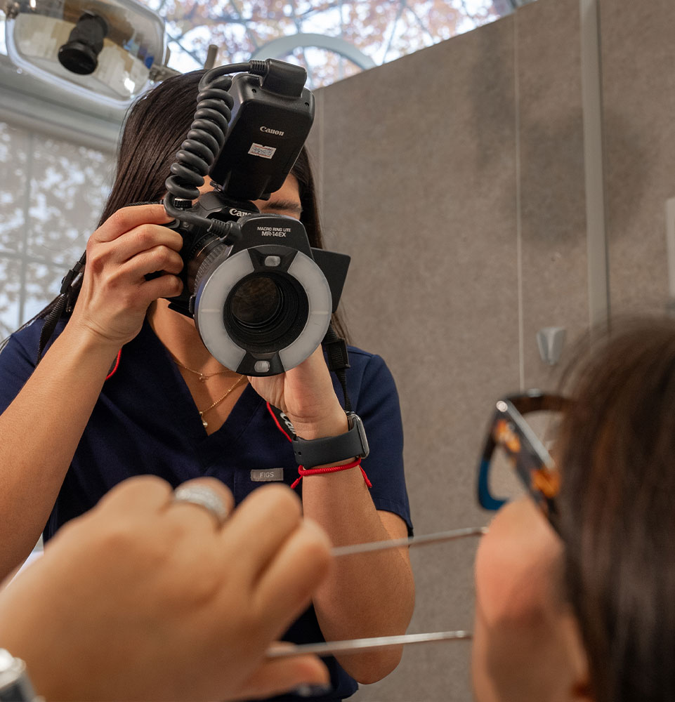 staff member taking a photo for patient dental procedure