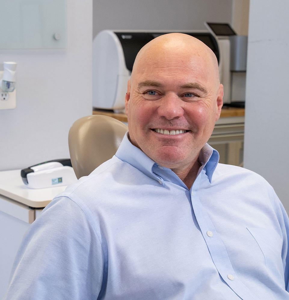 patient being helped at the front desk of the dental office