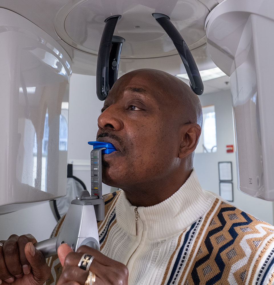 patient being examined by cbct scan for their treatment