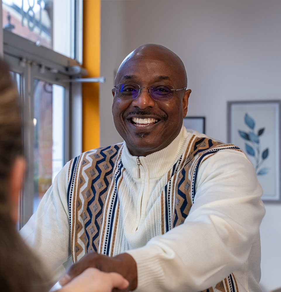 patient being helped at the front desk of the dental center