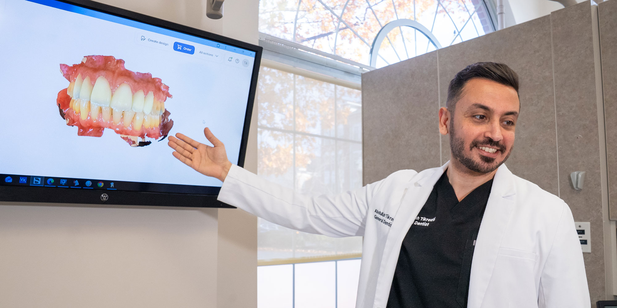 doctor showcasing dental veneer information to dental patient