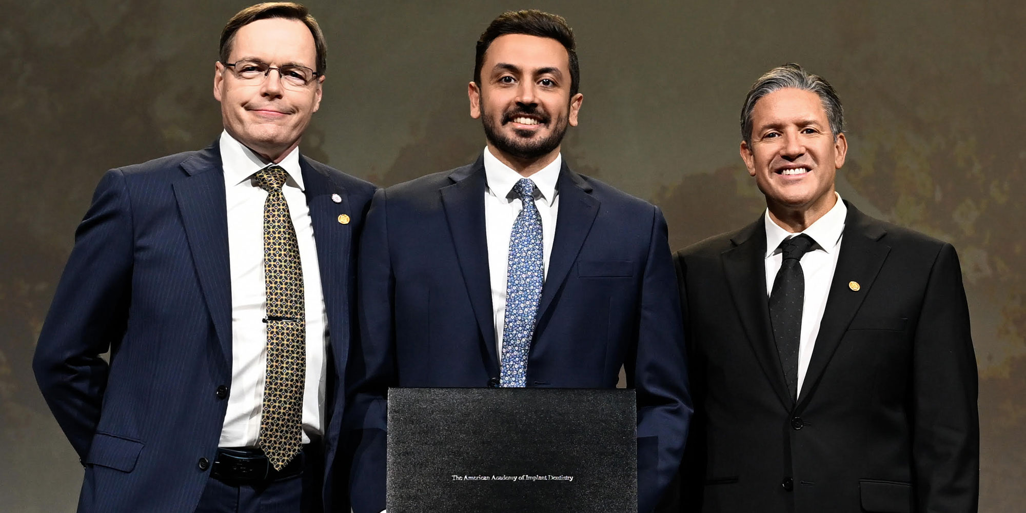 doctor showcasing their award during their ceremony
